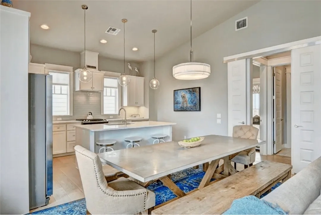 Devin Elder (DJE Texas) — Port Aransas beach house — Dining room & kitchen — open concept 717 Sunrise Ave Port Aransas TX — beach house — Dining room & kitchen — open concept