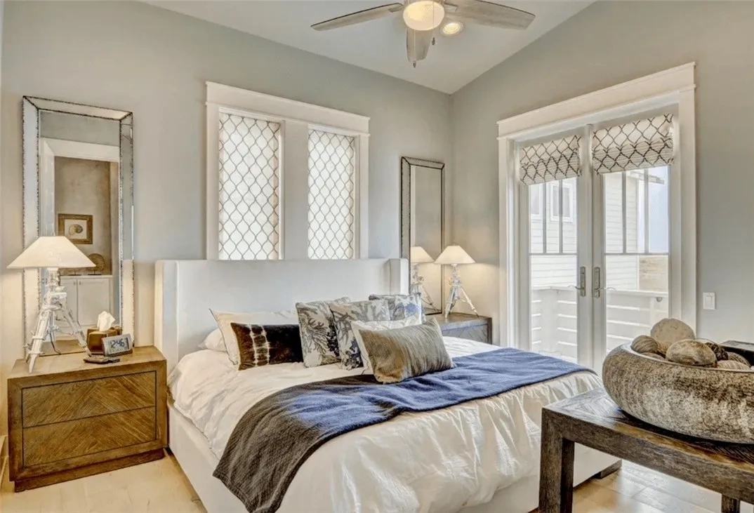 Devin Elder (DJE Texas) — Port Aransas beach house — Master bedroom with balcony access 717 Sunrise Ave Port Aransas TX — beach house — Master bedroom with balcony access